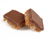 A three layer bar:  freshly roasted and salted cashews, our own soft & buttery caramel, all topped with creamy milk chocolate.